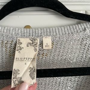 Light gray sweater.  Size small.